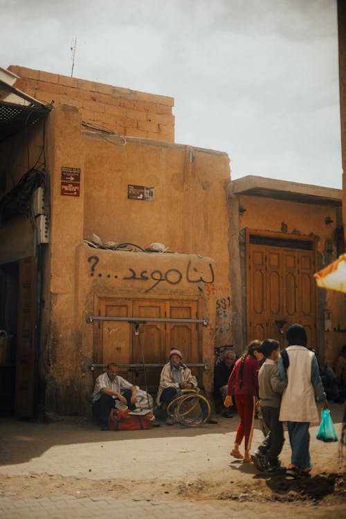 A group of people standing outside of a building