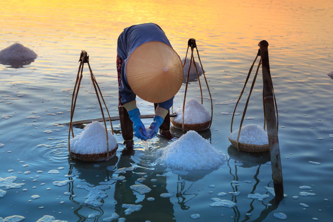 Bringing Salt Person Collecting Salt on Body of Water · Free Stock Photo