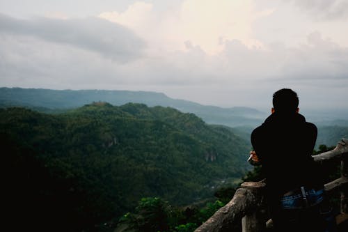 A person looking out over the mountains