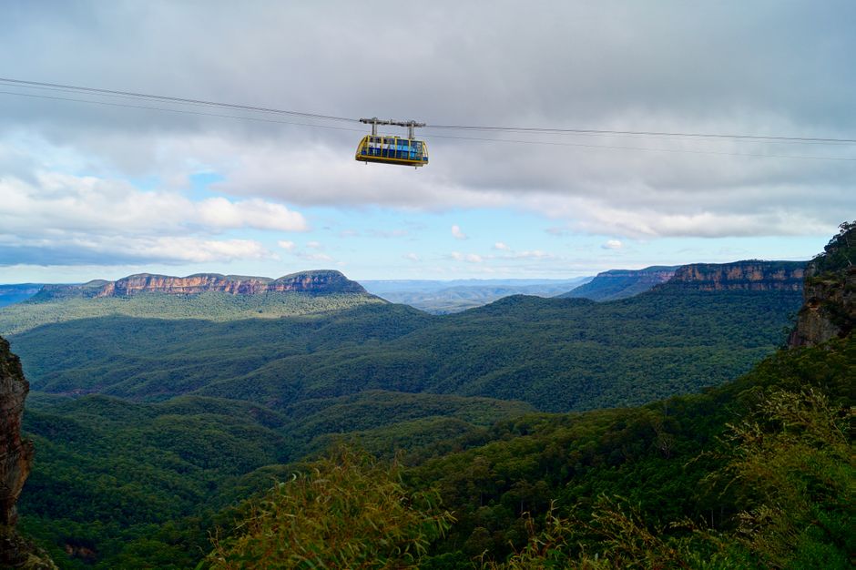 Scenic view of cable car above lush valleys in Blue Mountains, Australia.
