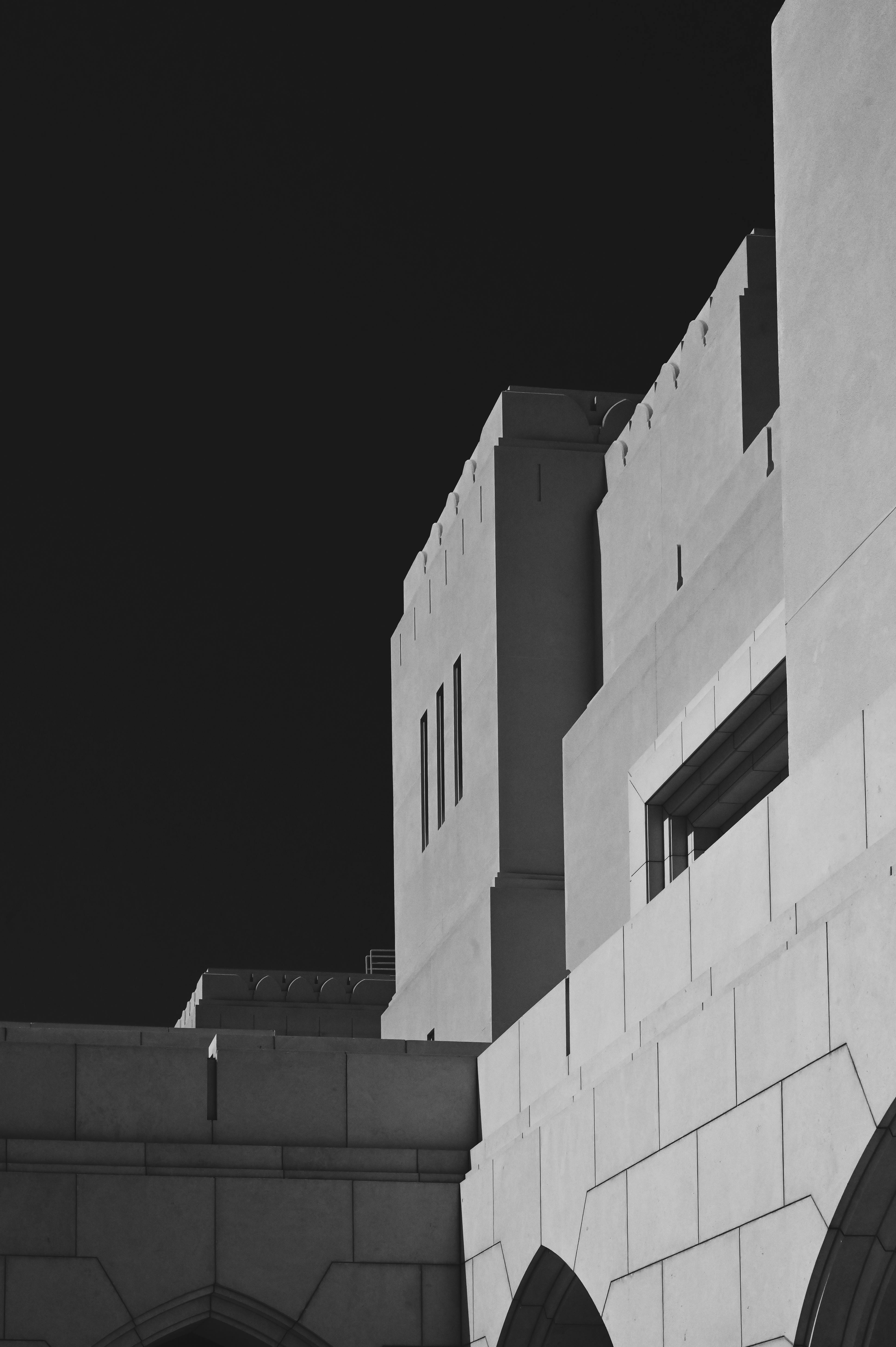 Black and white photo highlighting geometric architectural elements in Muscat, Oman.