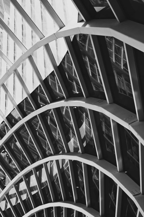 Free Abstract view of a modern glass structure in Muscat, Oman, showcasing intricate geometric patterns. Stock Photo