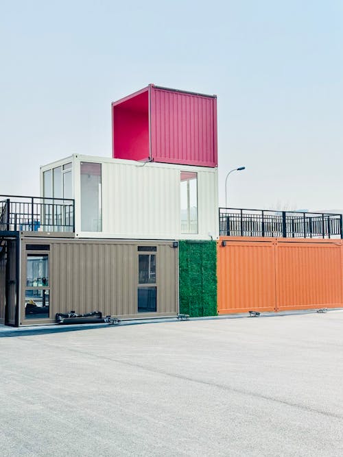 A container building with a colorful roof