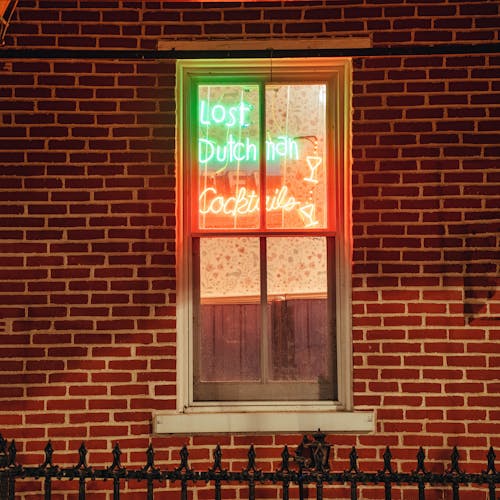 Free A neon sign in a window that says, 'don't drink the water' Stock Photo