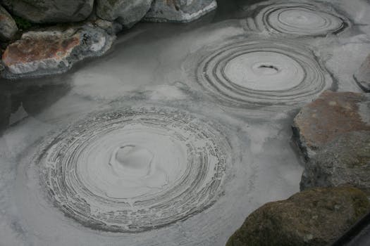 Captivating image of bubbling mud pools in Beppu, a renowned geothermal area in Japan.