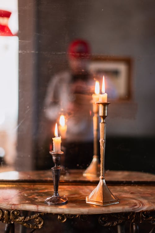 Free Candles on a table in front of a mirror Stock Photo