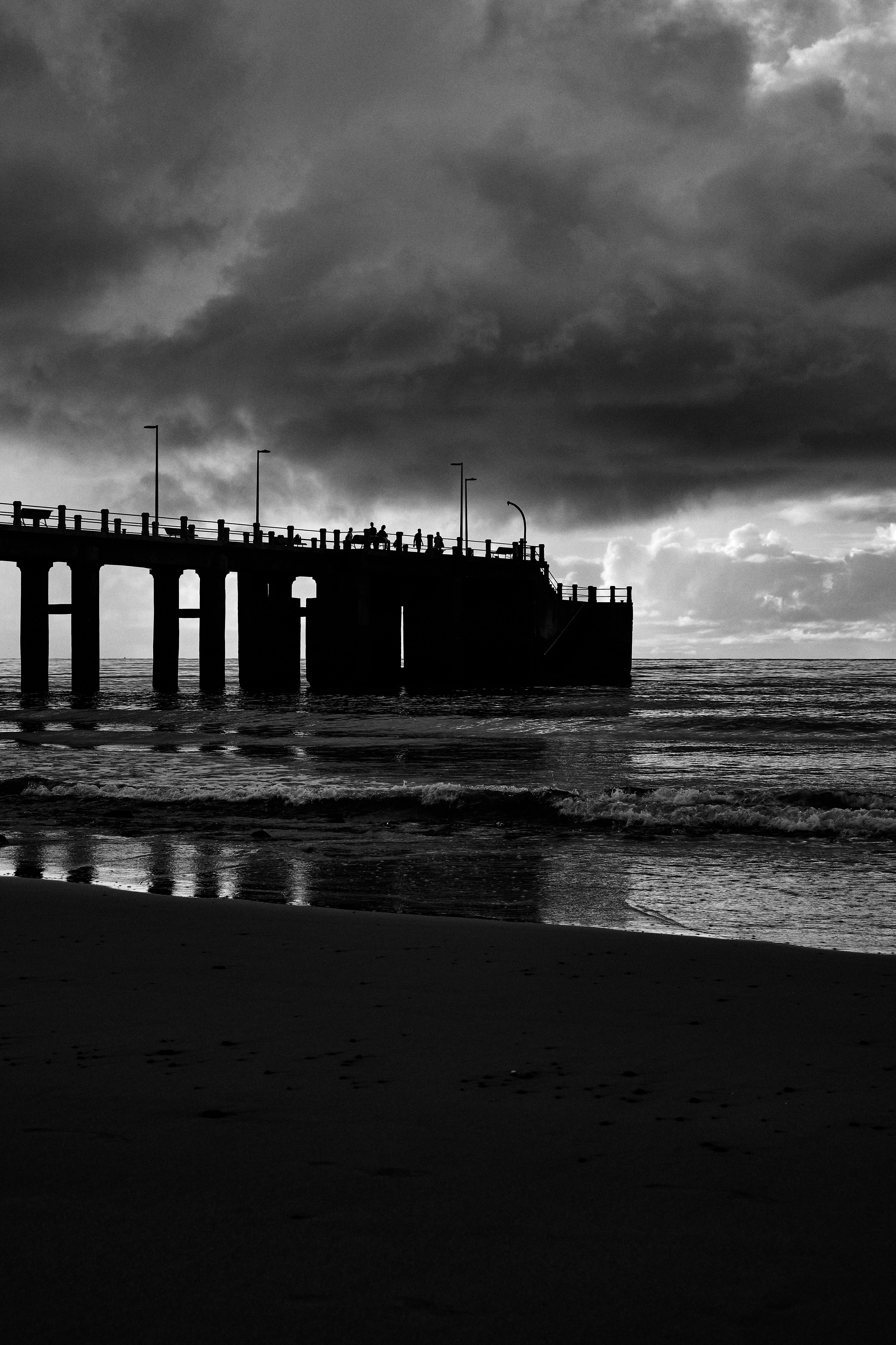 Silhouette of Pier by the Sea in Black and White · Free Stock Photo