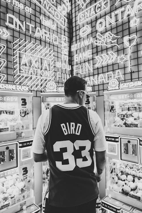 Free A man standing in front of a vending machine Stock Photo