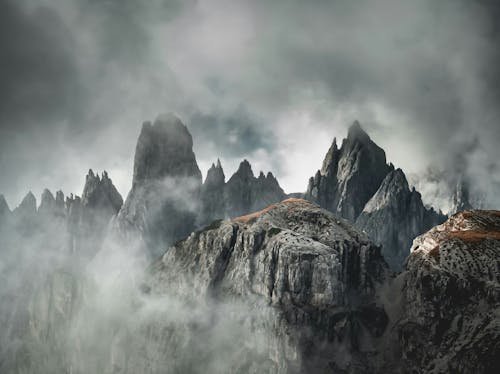 Mountains Peaks in Clouds on Sunset