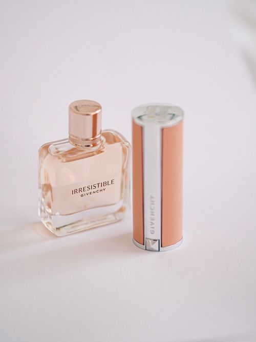 Free Minimalistic still life of Givenchy perfume bottle with elegant case on white background. Stock Photo