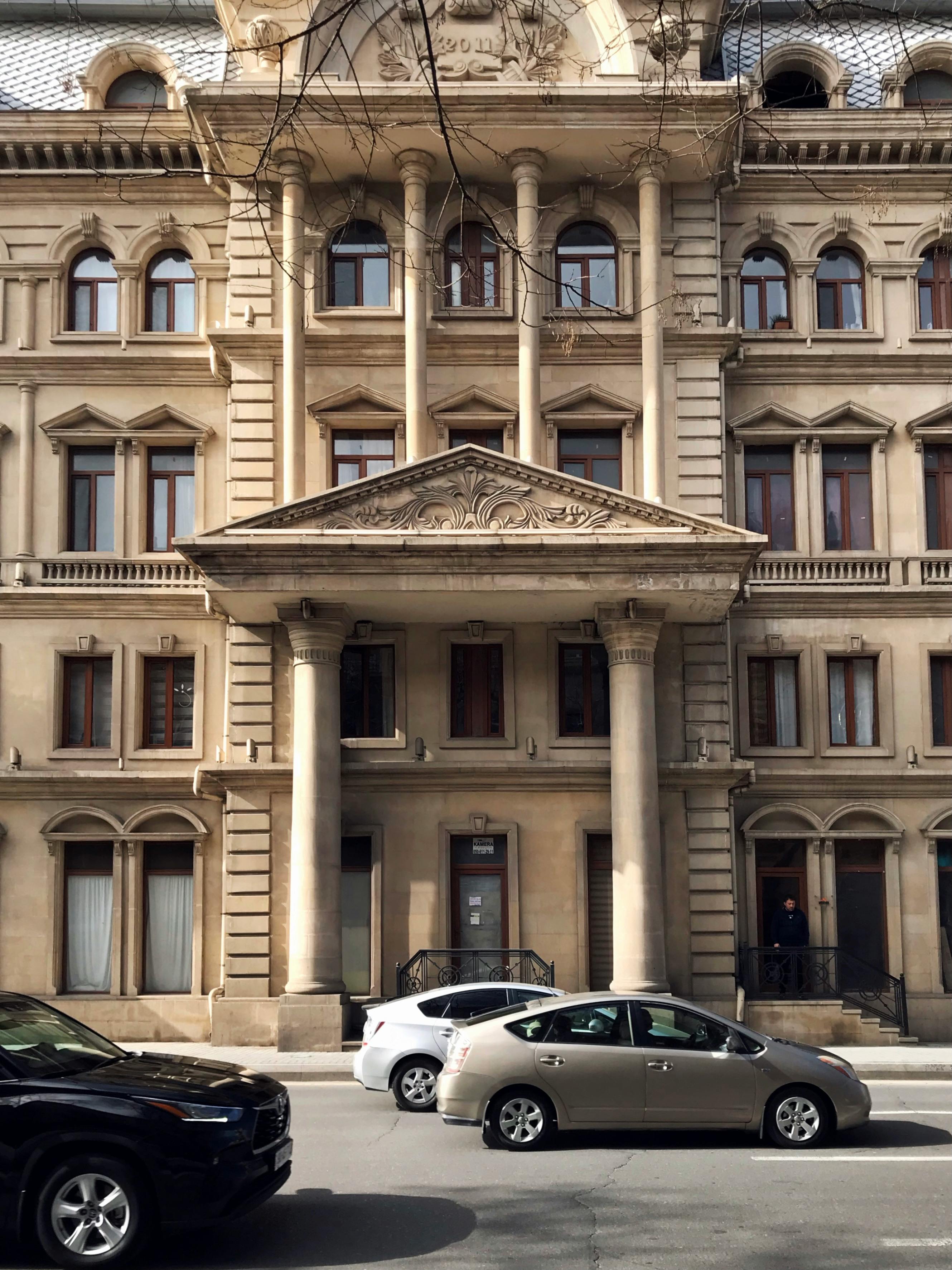 Facade Of A Building With Columns And Architectural Details By The ...