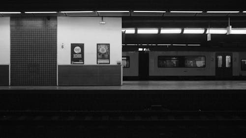 A black and white photo of a train station