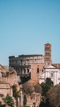 Stunning view of the Colosseum in Rome, showcasing ancient architecture under clear blue skies.