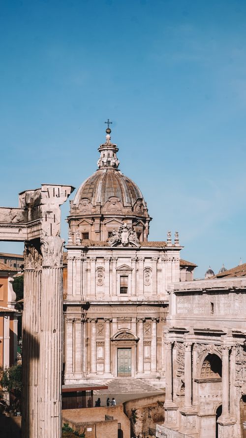 Free Explore the architectural beauty of Santi Luca e Martina Church amid Rome's historic landmarks. Stock Photo