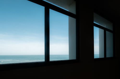 Free A view of the ocean through large windows Stock Photo