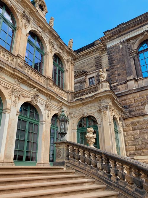 Free The ornate Zwinger Palace facade with statues and blue sky in Dresden, Germany. Stock Photo