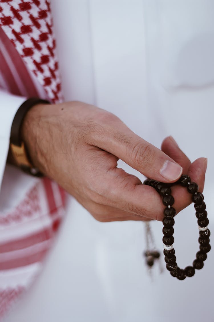 Man Hand Holding Muslim Rosary