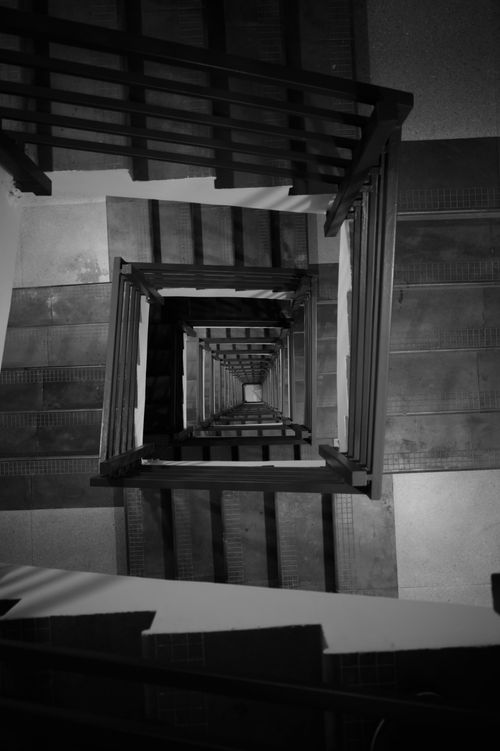 Free Black and white view of a spiral staircase in Bengaluru, India, showcasing symmetry and design. Stock Photo
