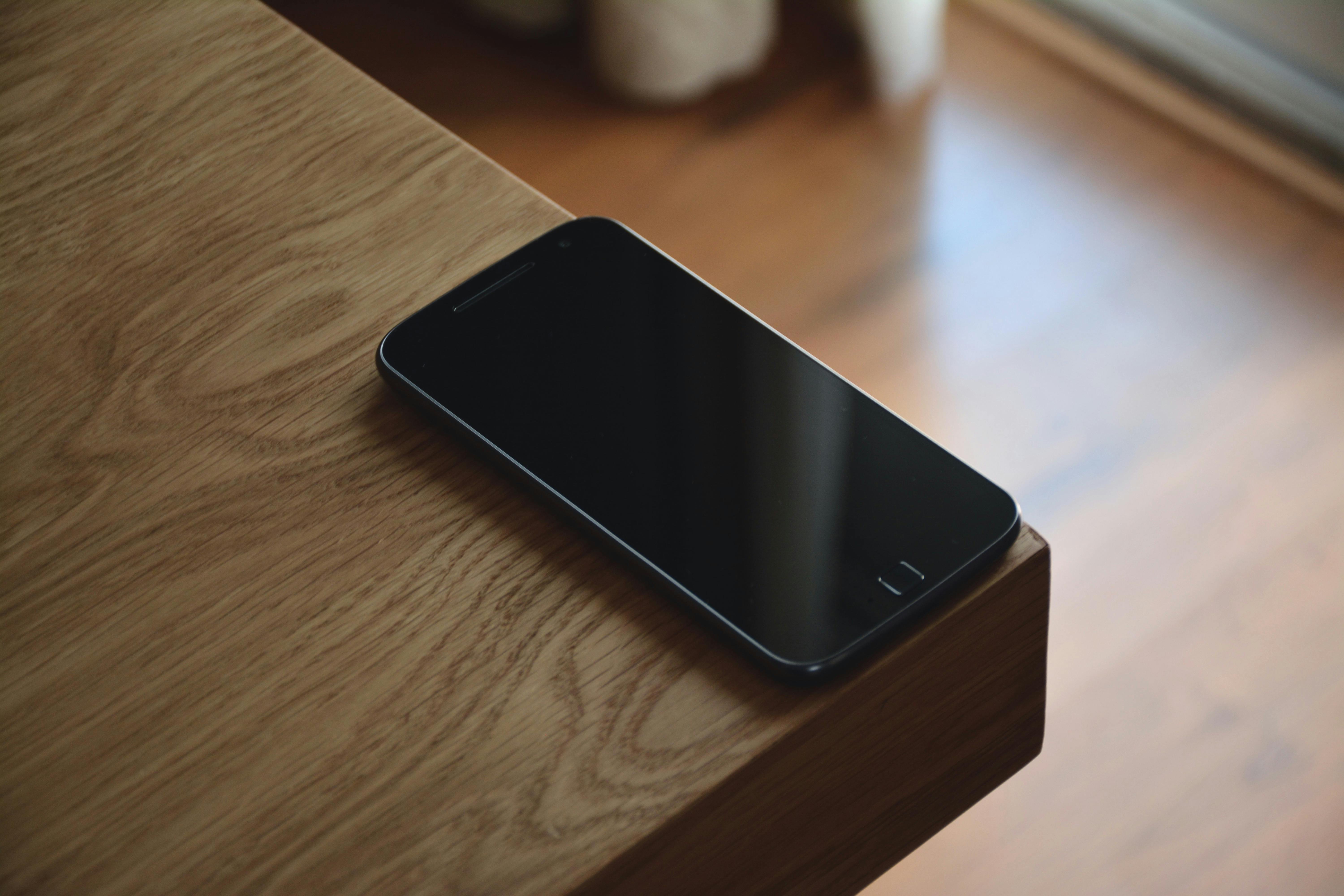 Black Android Smartphone on Corner Table · Free Stock Photo