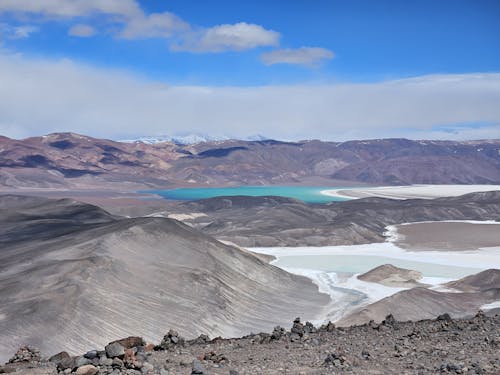 The view from the top of a mountain with blue water