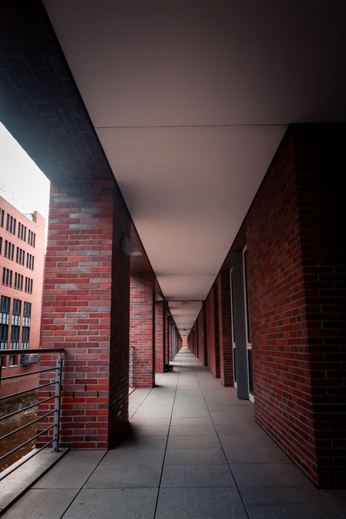 Free Explore the modern architectural beauty of Hamburg's red-brick colonnades and urban design. Stock Photo