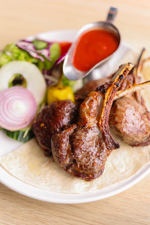 Free A plate with meat and vegetables on it Stock Photo