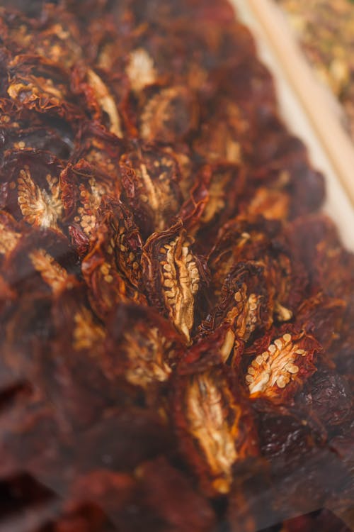 A close up of dried peppers on a tray
