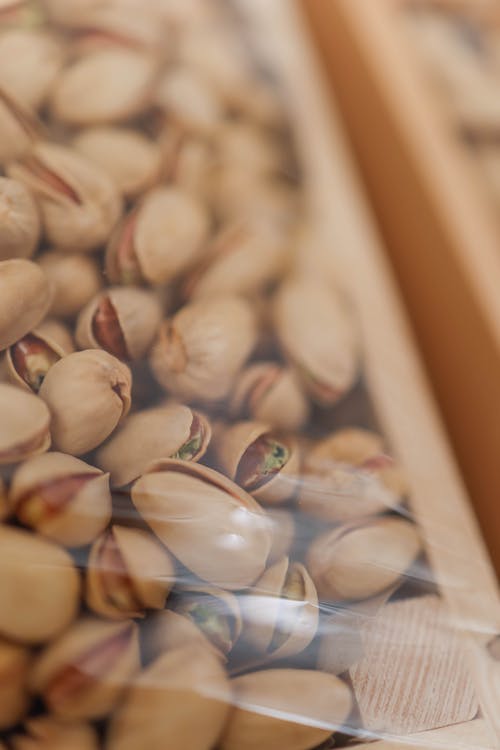 A close up of pistachios in a plastic bag