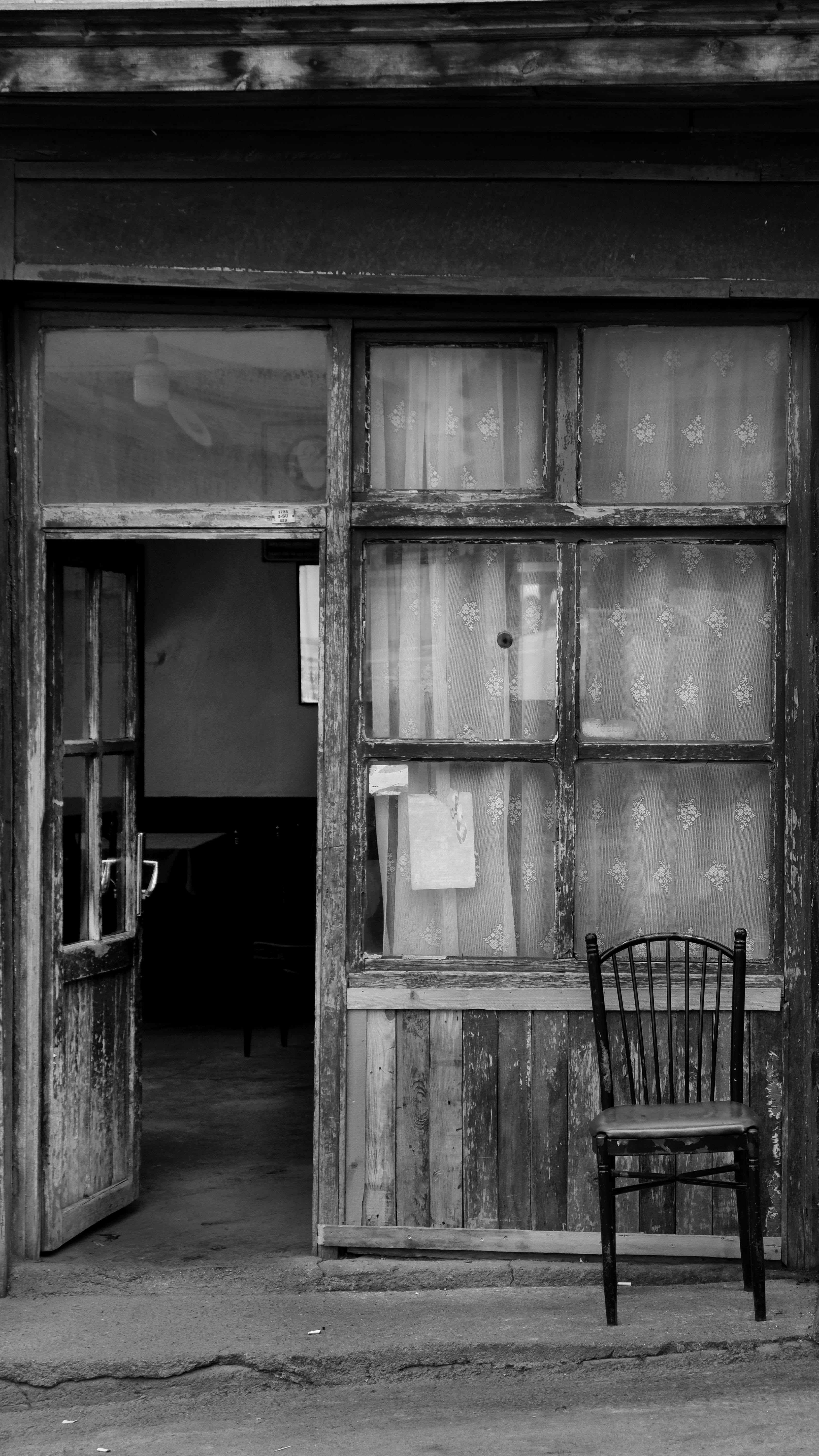 chair and open door of vintage house