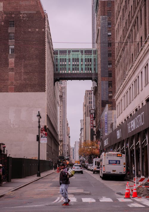 A person is walking down a city street