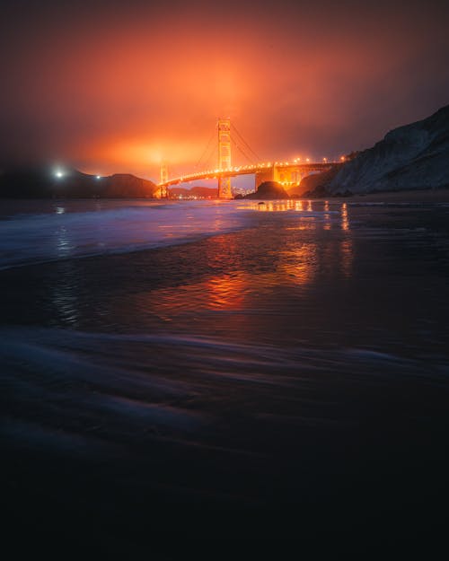 Kostnadsfri bild av bågbro, blå ocean, dimmig