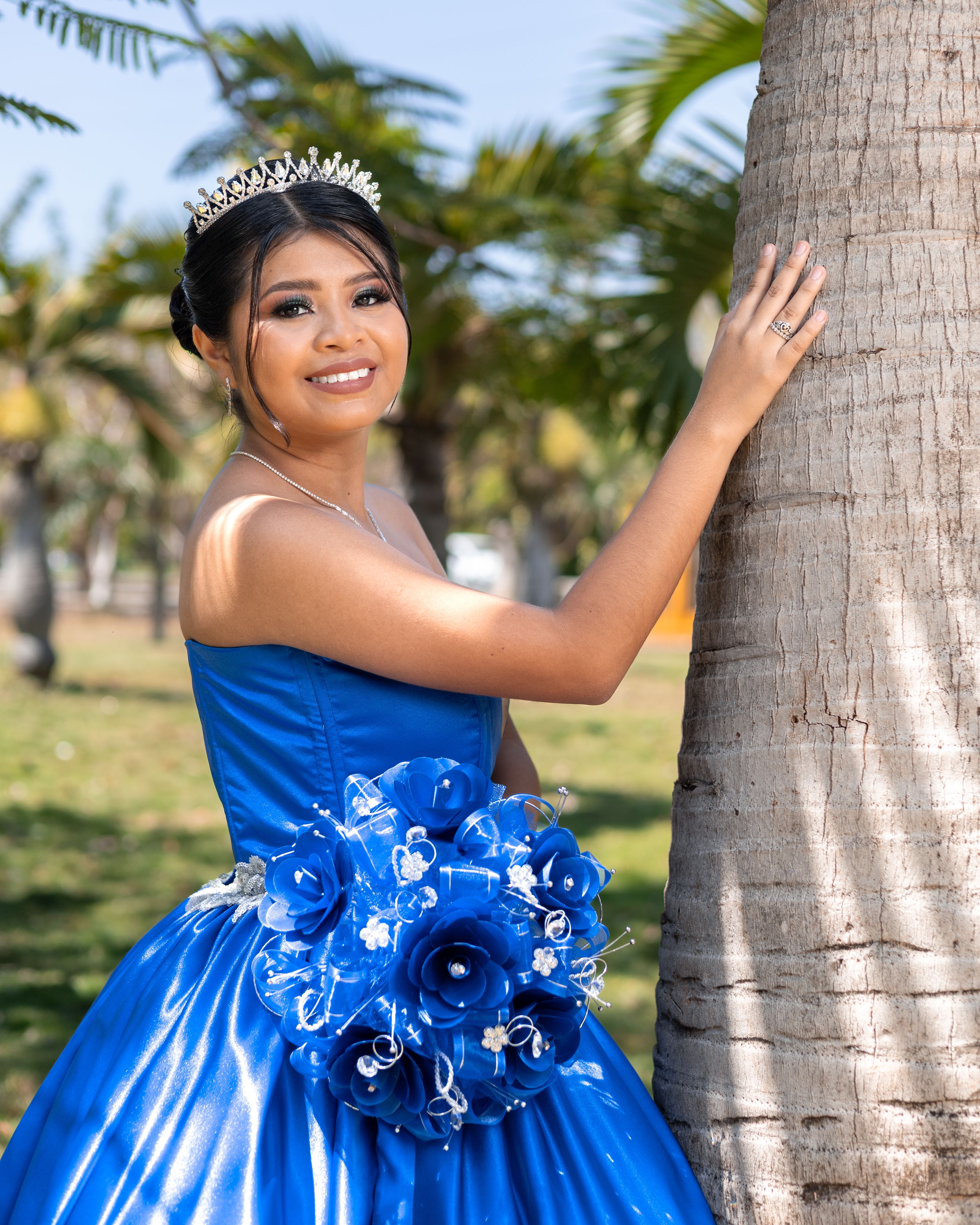 Photo of a Young Woman Wearing a Blue Dress and a Tiara · Free Stock Photo