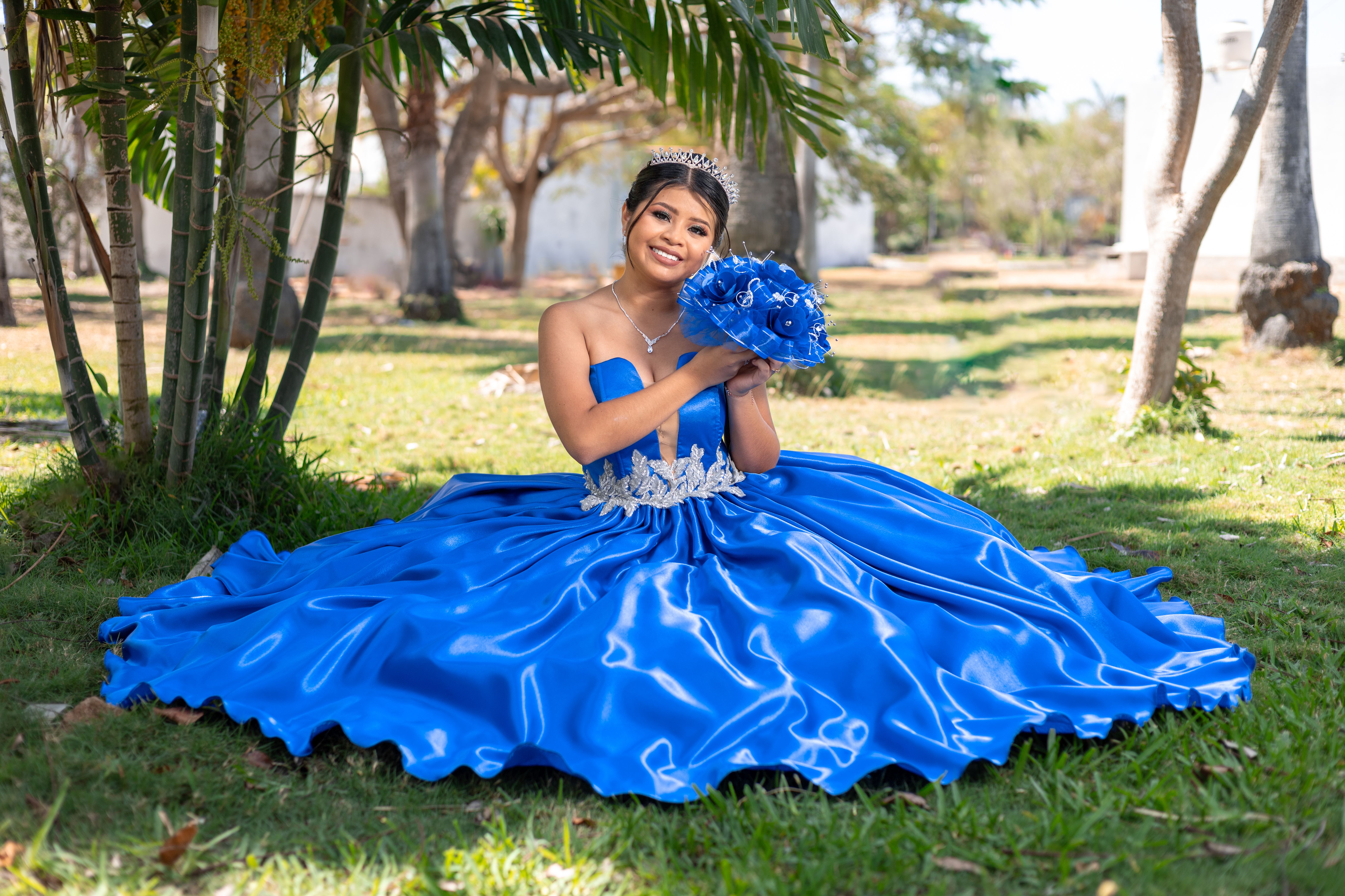 Woman in Blue Gown Sitting on Grass in Shade of Palm Tree · Free Stock ...