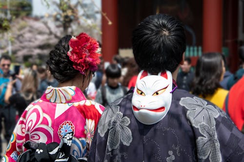 White Mask Behind Man's Head