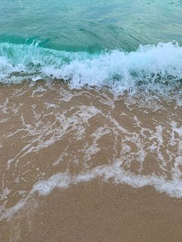 Serene waves gently lapping the sandy shore in Fort Lauderdale.