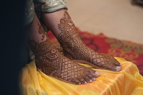 Free A woman's feet with henna designs on them Stock Photo