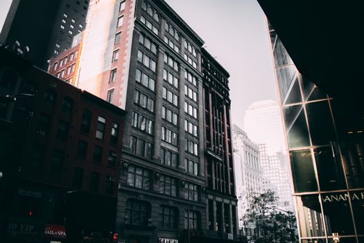 A dynamic view of high-rise buildings in downtown New York City during the day.