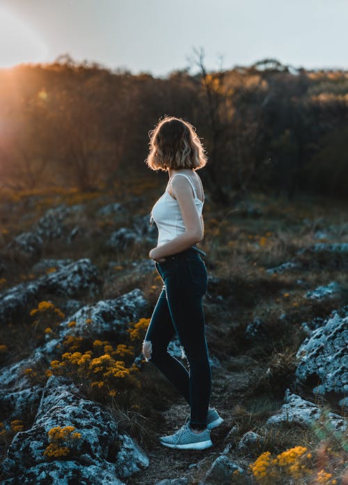 Woman Standing On Rock