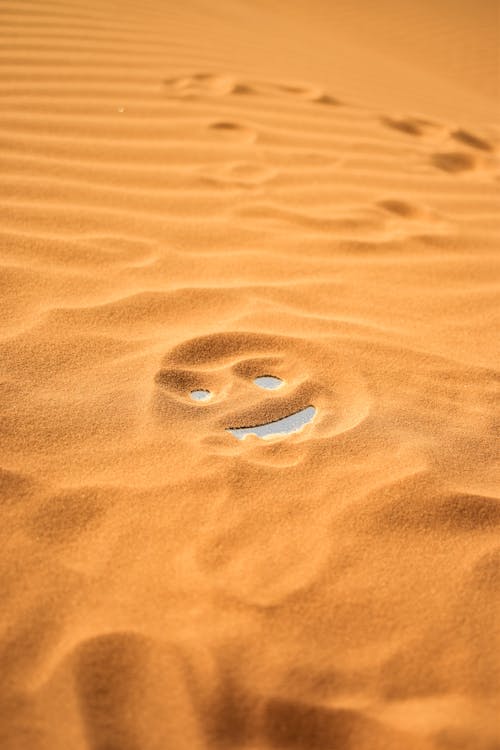 Free Smiley Face On Sand Stock Photo