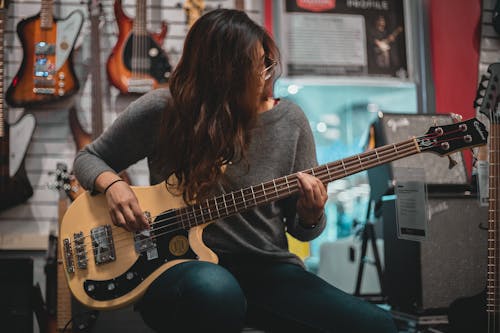 Woman Playing Bass Guitar