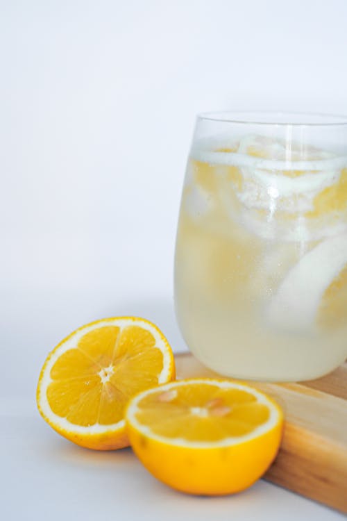 Free A glass of lemonade with slices of lemon on top Stock Photo