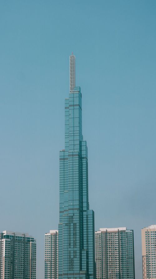 Free A stunning view of the Landmark 81 skyscraper standing tall against a clear sky in Ho Chi Minh City. Stock Photo