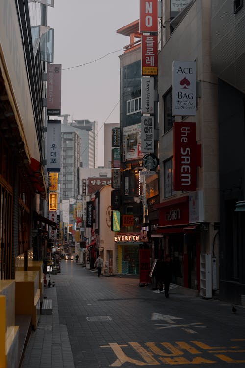 A street with many buildings and signs