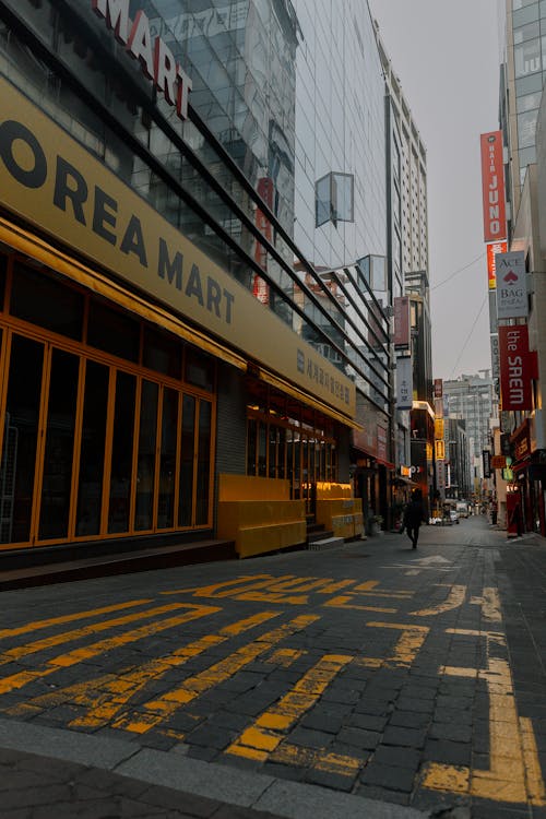 A street with yellow and black lines on it