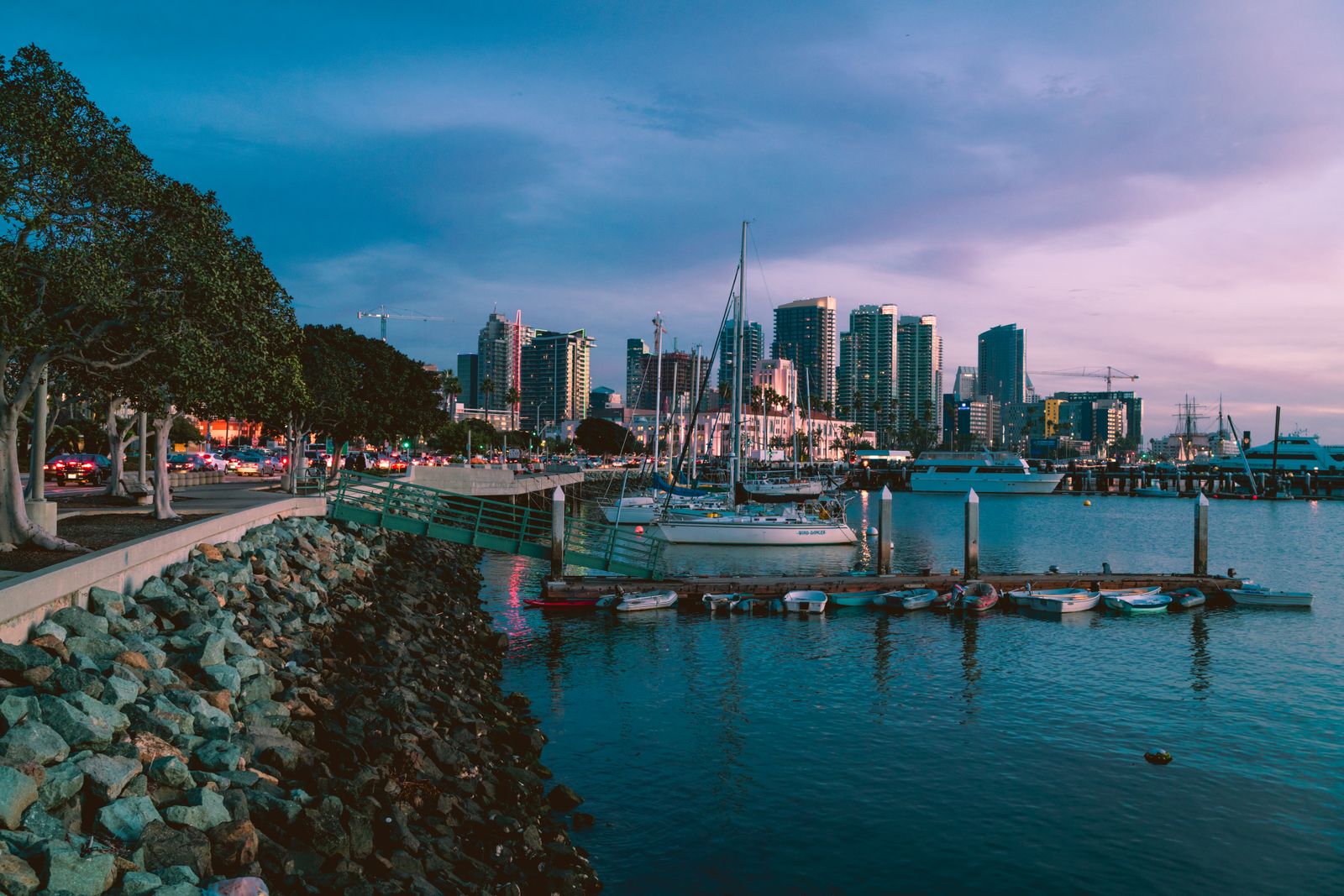 San Diego marina at golden hour with docked boats and skyline