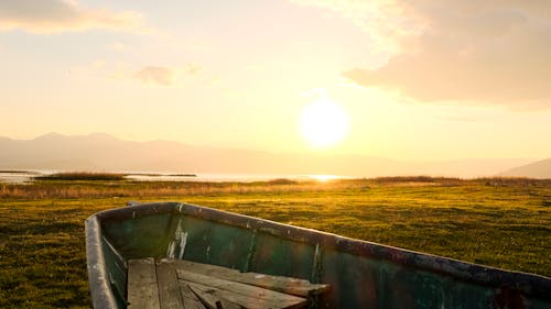 Free Boat on the Lakeshore at Dawn  Stock Photo