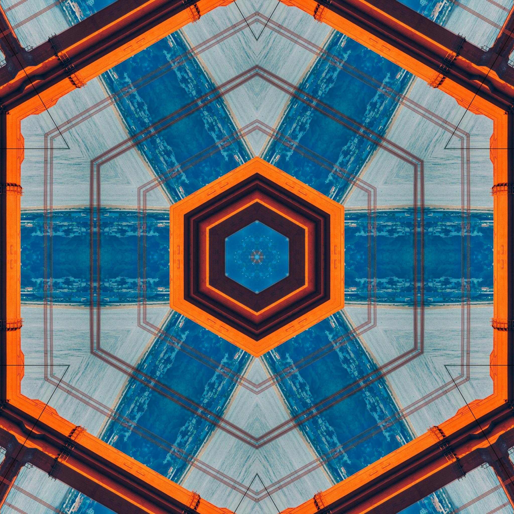 这幅色彩缤纷的几何抽象艺术，以大胆的橙色和蓝色色调为特色，图案对称