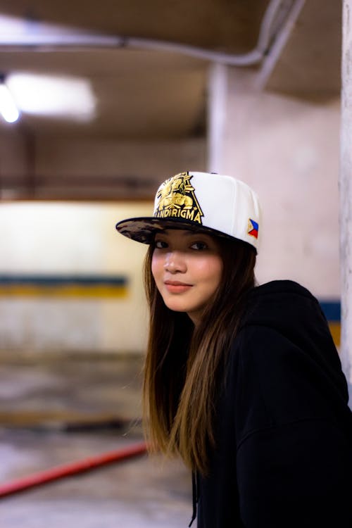 Free A girl wearing a hat and a black jacket Stock Photo