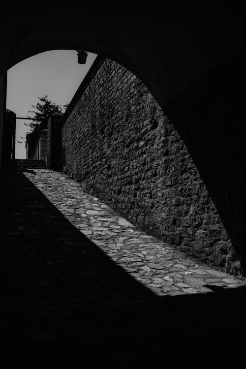 A black and white photo of a tunnel