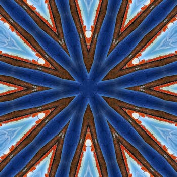 这款充满活力、动感的抽象万花筒图案，采用蓝橙色调，非常适合创意设计